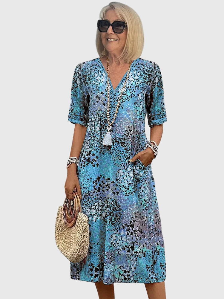 Women’s Floral Midi Dress with Flowing Silhouette and Elegant Print